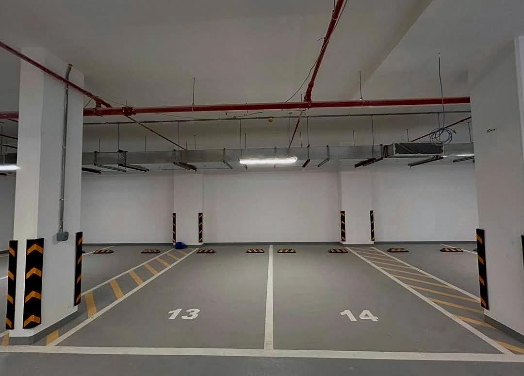 Numbered parking bays with coated floor and marked lines in Bahrain